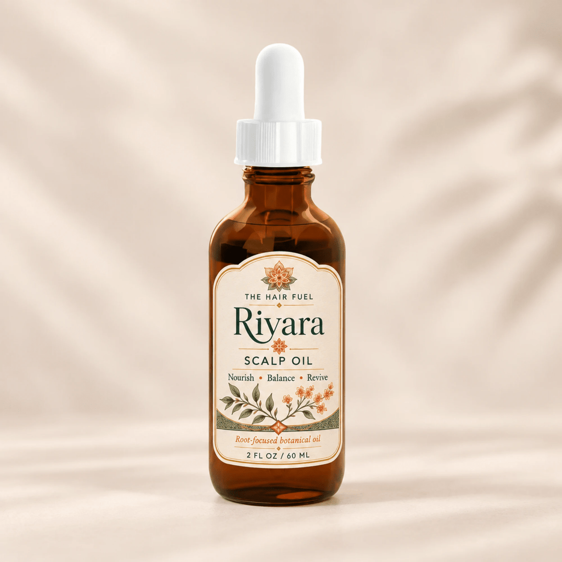 An amber glass bottle of Rivara Scalp Oil with a white dropper cap, centered against a warm beige background with soft leaf shadows.